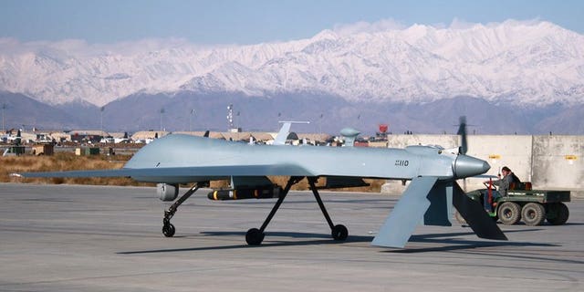A US drone armed with a missile sets off from its hangar at Bagram Air Base in Afghanistan. At least six people were killed in a US drone strike on a militant compound in a northwestern Pakistani tribal area, security officials have told AFP.