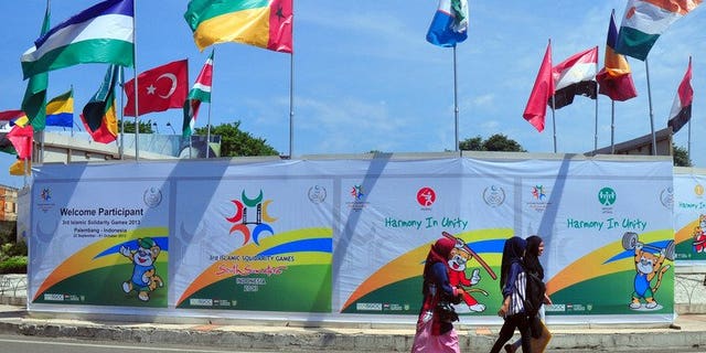 The flags of countries participating in the Islamic Solidarity Games decorate a venue at the Palembang sports complex in Palembang on Indonesia's Sumatra island on September 20, 2013. The games got under way in Indonesia on Sunday despite a chaotic run-up to the event and debates over appropriate outfits for Muslim athletes.