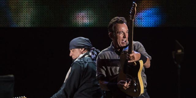 American Bruce Springsteen (R) performs during the Rock in Rio music festival in Rio de Janeiro, Brazil, on September 22, 2013.