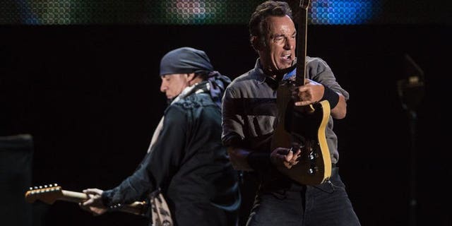 American Bruce Springsteen (R) performs during the Rock in Rio music festival in Rio de Janeiro, Brazil, on September 22, 2013.