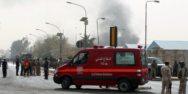File picture shows an ambulance arriving at the scene of a bomb attack in Baghdad, on March 14, 2013. A bomb exploded near an ambulance taking a pregnant woman to hospital in Iraq on Monday, wounding her and killing two people, police and a doctor said.