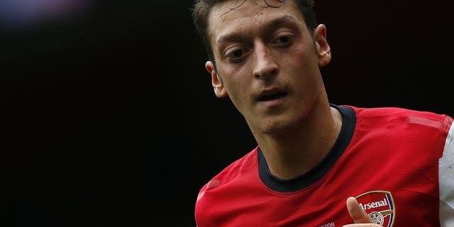 Arsenal's German midfielder Mesut Ozil plays at the Emirates stadium in north London on September 22, 2013.
