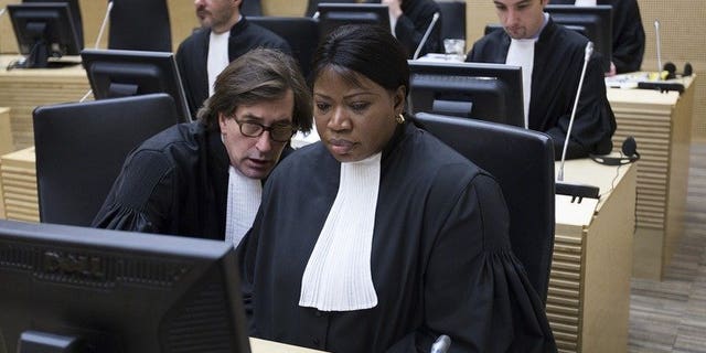 International Criminal Court Prosecutor Fatou Bensouda (right) and senior trial lawyer Eric Mac Donald on February 19, 2013 in The Hague. Bensouda offered Tuesday to help prosecute those behind the deadly attack on Nairobi's Westgate shopping mall, a statement said.