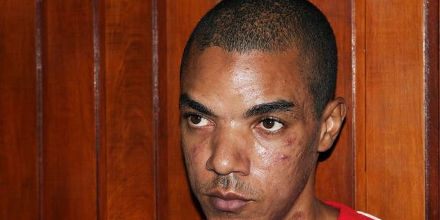 Briton Jermaine Grant sits in court in Kenya's coastal town of Mombasa on May 9, 2012. Grant, accused of ties to Somalia's Al-Qaeda-linked Shebab, appeared in a Kenyan court on Tuesday on explosives charges.