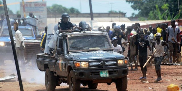 A Guinean police vehicle patrols as protesters clash with the police on September 23, 2013 in Conakry.