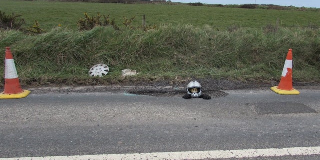 Joce was trying to draw attention to a large, dangerous pothole at the entrance to his town.