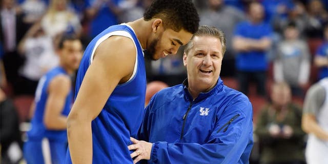 Jan 20, 2015; Lexington, KY, USA; Kentucky Wildcats head coach John Calipari reacts in the huddle with guard Tyler Ulis (3) guard Andrew Harrison (5) and forward Karl-Anthony Towns (12) during the game against the Vanderbilt Commodores in the second half at Rupp Arena. The Kentucky Wildcats defeated the Vanderbilt Commodores 65-57. Mandatory Credit: Mark Zerof-USA TODAY Sports