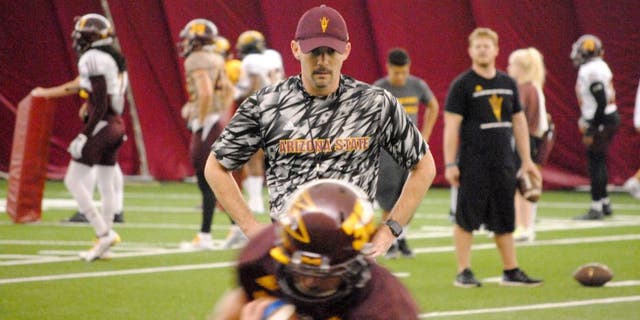 ASU offensive coordinator Mike Norvell watches the running backs in ball protection drill inside the Verde Dickey Dome on October 6, 2015 in Tempe.