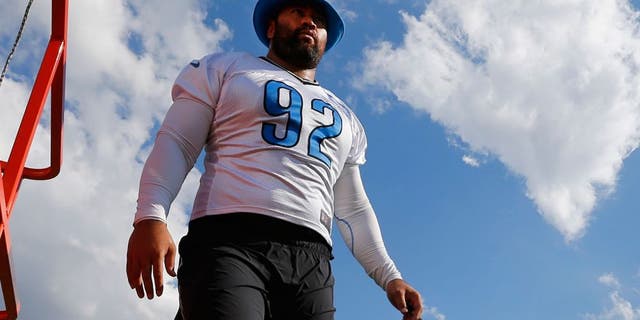 Detroit Lions defensive tackle Haloti Ngata walks on the practice field during NFL football training camp in Allen Park, Mich., Monday, Aug. 3, 2015. (AP Photo/Paul Sancya)