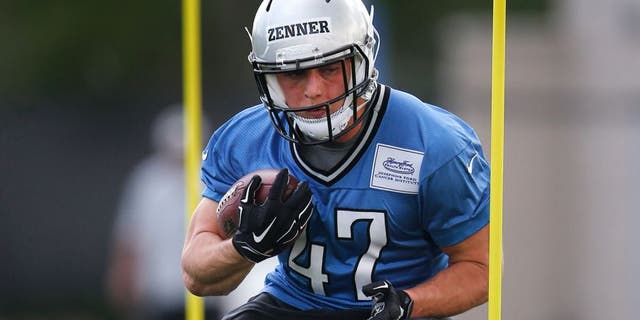 Detroit Lions running back Zach Zenner runs a drill during an NFL football rookie minicamp practice in Allen Park, Mich., Friday, May 8, 2015. (AP Photo/Paul Sancya)
