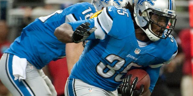 Nov 28, 2013; Detroit, MI, USA; Detroit Lions running back Joique Bell (35) runs the ball during the first quarter against the Green Bay Packers during a NFL football game on Thanksgiving at Ford Field. Mandatory Credit: Tim Fuller-USA TODAY Sports