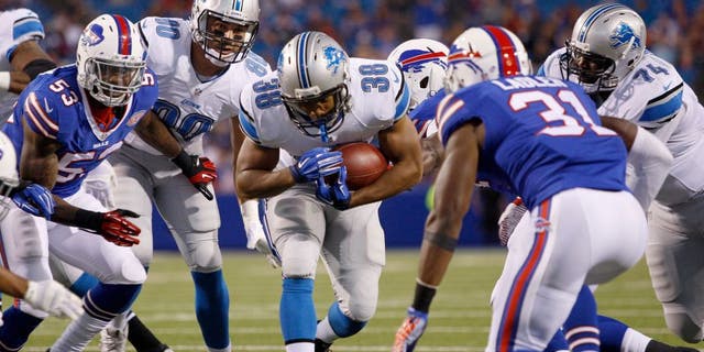 Aug 28, 2014; Orchard Park, NY, USA; Detroit Lions running back George Winn (38) runs the ball during the first half against the Buffalo Bills at Ralph Wilson Stadium. Mandatory Credit: Timothy T. Ludwig-USA TODAY Sports