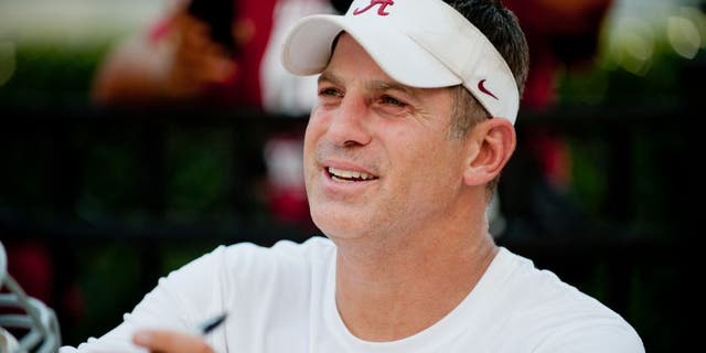 Aug 4, 2013; Tuscaloosa, AL, USA; Alabama Crimson Tide defensive coordinator Doug Nussmeier signs autographs following practice at Bryant Denny Stadium. Mandatory Credit: Kevin Liles-USA TODAY Sports