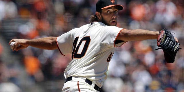 Sunday, May 25: San Francisco Giants pitcher Madison Bumgarner throws against the Minnesota Twins during the first inning.