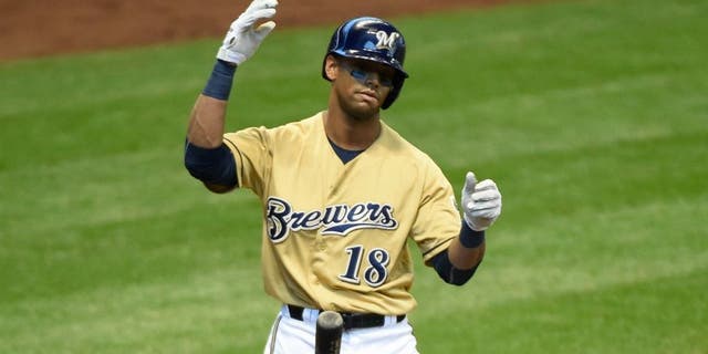 Apr 26, 2015; Milwaukee, WI, USA; Milwaukee Brewers left fielder Khris Davis (18) reacts after striking out in the first inning during the game against the St. Louis Cardinals at Miller Park. Mandatory Credit: Benny Sieu-USA TODAY Sports