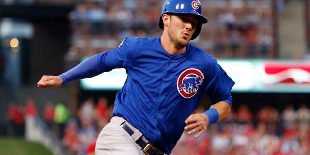 Chicago Cubs' Kris Bryant rounds third and heads in to score on a single by Starlin Castro during the first inning of a baseball game against the St. Louis Cardinals, Monday, May 4, 2015, in St. Louis. (AP Photo/Jeff Roberson)