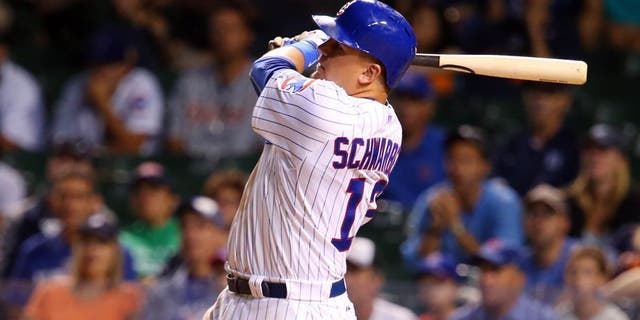 Aug 18, 2015; Chicago, IL, USA; Chicago Cubs outfielder Kyle Schwarber hits a three-run home run against the Detroit Tigers during the fifth inning at Wrigley Field. Mandatory Credit: Jerry Lai-USA TODAY Sports