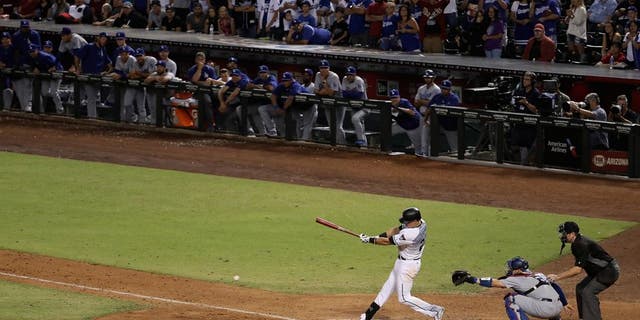 PHOENIX, AZ - SEPTEMBER 16: Jake Lamb #22 of the Arizona Diamondbacks bats against the Los Angeles Dodgers during the ninth inning of the MLB game at Chase Field on September 16, 2016 in Phoenix, Arizona. (Photo by Christian Petersen/Getty Images)