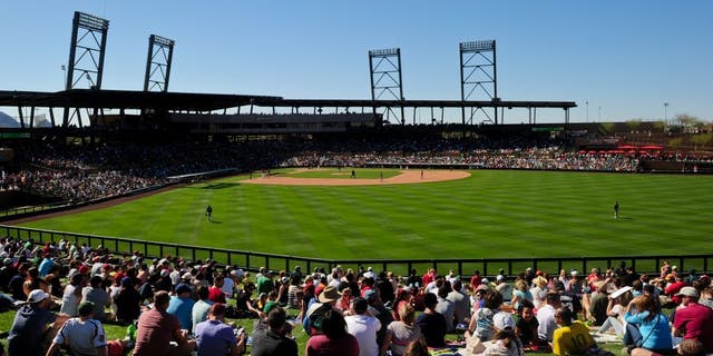 Mar 6, 2015; Salt River Pima-Maricopa, AZ, USA; Fans watch the game between the Arizona Diamondbacks and the Oakland Athletics from the outfield lawn during a spring training baseball game at Salt River Fields at Talking Stick. Mandatory Credit: Matt Kartozian-USA TODAY Sports