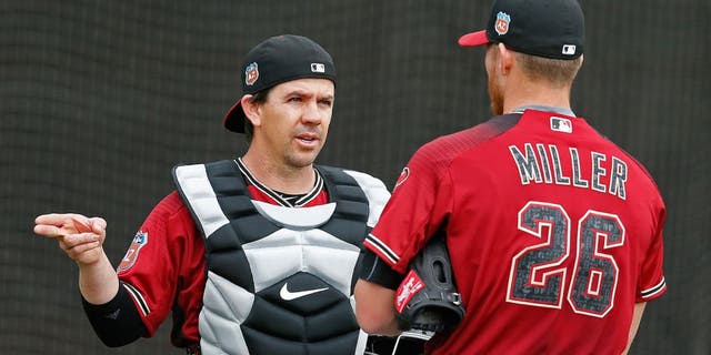 Feb 19, 2016; Scottsdale, AZ, USA; Arizona Diamondbacks catcher Tuffy Gosewisch (8) talks to pitcher Shelby Miller (26) during spring training camp at Salt River Fields. Mandatory Credit: Rick Scuteri-USA TODAY Sports