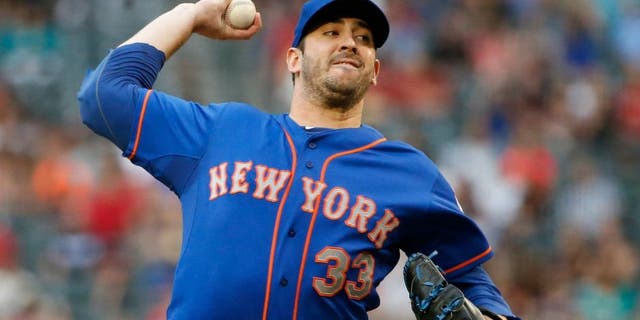New York Mets' Matt Harvey throws a pitch against the Arizona Diamondbacks during the first inning of a baseball game Thursday, June 4, 2015, in Phoenix. (AP Photo/Ross D. Franklin)