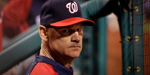 May 11, 2014; Oakland, CA, USA; Washington Nationals manager Matt Williams (9) stands in the dugout against the Oakland Athletics during the sixth inning at O.co Coliseum. The Athletics defeated the Nationals 9-1. Mandatory Credit: Kyle Terada-USA TODAY Sports