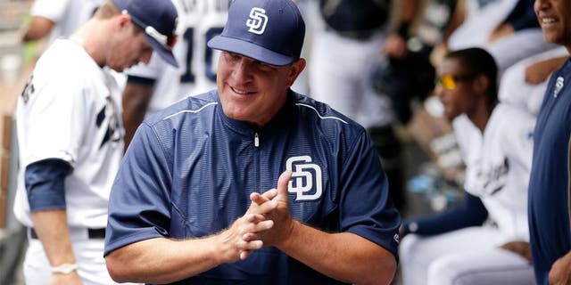 San Diego Padres interim manager Pat Murphy looks on from the dugout before the Padres play the Oakland Athletics in a baseball game Tuesday, June 16, 2015, in San Diego. (AP Photo/Gregory Bull)