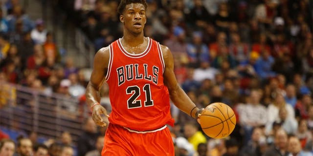 Nov 25, 2014; Denver, CO, USA; Chicago Bulls guard Jimmy Butler (21) during the game against the Denver Nuggets at Pepsi Center. Mandatory Credit: Chris Humphreys-USA TODAY Sports