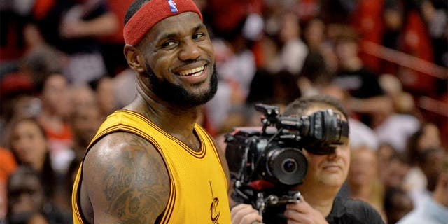 Dec 25, 2014; Miami, FL, USA; Cleveland Cavaliers forward LeBron James (23) smiles after losing to the Miami Heat at American Airlines Arena. The Heat won 101-91. Mandatory Credit: Steve Mitchell-USA TODAY Sports