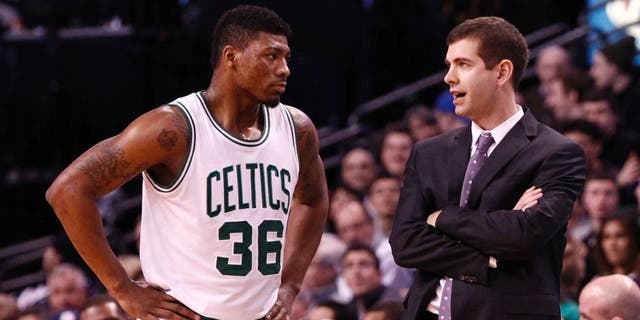 Jan 30, 2015; Boston, MA, USA; Boston Celtics head coach Brad Stevens (right) speaks to guard Marcus Smart (36) during the second half of a game against the Houston Rockets at TD Garden. Mandatory Credit: Mark L. Baer-USA TODAY Sports