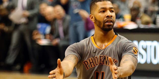 Feb 26, 2015; Phoenix, AZ, USA; Phoenix Suns forward Markieff Morris (11) reacts after scoring against the Oklahoma City Thunder during the fourth quarter at US Airways Center. Mandatory Credit: Rick Scuteri-USA TODAY Sports