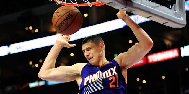 November 15, 2014; Los Angeles, CA, USA; Phoenix Suns center Alex Len (21) dunks to score a basket against the Los Angeles Clippers during the first half at Staples Center. Mandatory Credit: Gary A. Vasquez-USA TODAY Sports