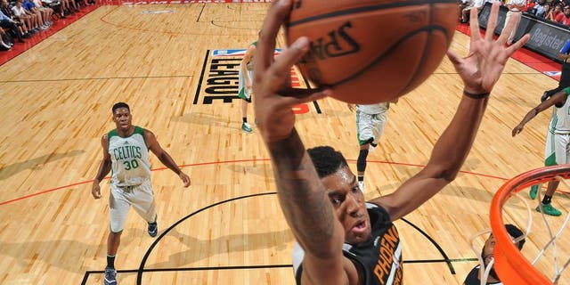 LAS VEGAS, NV - JULY 10: Marquese Chriss #0 of Phoenix Suns goes for the dunk during the game against the Boston Celtics during the 2016 NBA Las Vegas Summer League on July 10, 2016 at the Thomas &amp; Mack Center in Las Vegas, Nevada. NOTE TO USER: User expressly acknowledges and agrees that, by downloading and or using this photograph, user is consenting to the terms and conditions of Getty Images License Agreement. Mandatory Copyright Notice: Copyright 2016 NBAE (Photo by Garrett Ellwood/NBAE via Getty Images)