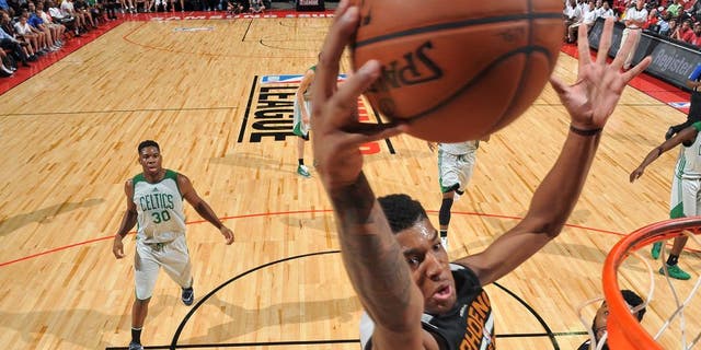 LAS VEGAS, NV - JULY 10: Marquese Chriss #0 of Phoenix Suns goes for the dunk during the game against the Boston Celtics during the 2016 NBA Las Vegas Summer League on July 10, 2016 at the Thomas & Mack Center in Las Vegas, Nevada. NOTE TO USER: User expressly acknowledges and agrees that, by downloading and or using this photograph, user is consenting to the terms and conditions of Getty Images License Agreement. Mandatory Copyright Notice: Copyright 2016 NBAE (Photo by Garrett Ellwood/NBAE via Getty Images)
