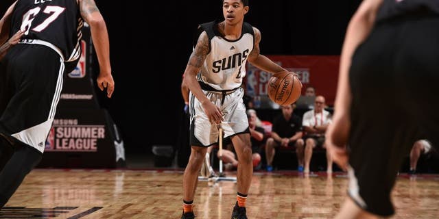 LAS VEGAS, NV - JULY 12: Tyler Ulis #8 of the Phoenix Suns handles the ball against the Miami Heat during the 2016 NBA Las Vegas Summer League on July 12, 2016 at The Thomas & Mack Center in Las Vegas, Nevada. NOTE TO USER: User expressly acknowledges and agrees that, by downloading and or using this photograph, user is consenting to the terms and conditions of Getty Images License Agreement. Mandatory Copyright Notice: Copyright 2016 NBAE (Photo by Garrett Ellwood/NBAE via Getty Images)