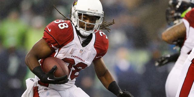 Dec 22, 2013; Seattle, WA, USA; Arizona Cardinals running back Andre Ellington (38) rushes against the Seattle Seahawks during the third quarter at CenturyLink Field. Mandatory Credit: Joe Nicholson-USA TODAY Sports