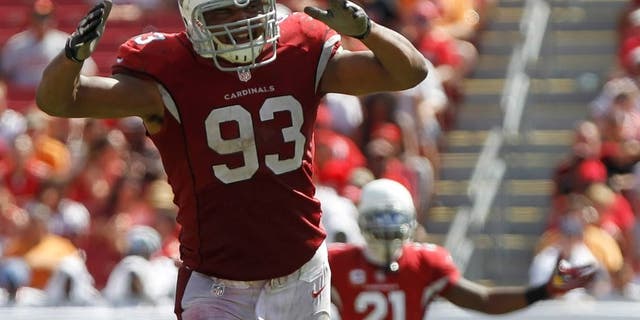 Sep 29, 2013; Tampa, FL, USA; Arizona Cardinals defensive end Calais Campbell (93) and cornerback Patrick Peterson (21) reacts against the Tampa Bay Buccaneers during the second half at Raymond James Stadium. Arizona Cardinals defeated the Tampa Bay Buccaneers 13-10. Mandatory Credit: Kim Klement-USA TODAY Sports