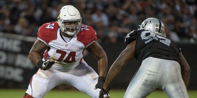 August 30, 2015; Oakland, CA, USA; Arizona Cardinals offensive tackle D.J. Humphries (74) blocks Oakland Raiders defensive end Mario Jr. Edwards (97) during the fourth quarter in a preseason NFL football game at O.co Coliseum. The Cardinals defeated the Raiders 30-23. Mandatory Credit: Kyle Terada-USA TODAY Sports