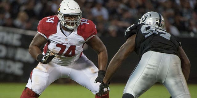 August 30, 2015; Oakland, CA, USA; Arizona Cardinals offensive tackle D.J. Humphries (74) blocks Oakland Raiders defensive end Mario Jr. Edwards (97) during the fourth quarter in a preseason NFL football game at O.co Coliseum. The Cardinals defeated the Raiders 30-23. Mandatory Credit: Kyle Terada-USA TODAY Sports