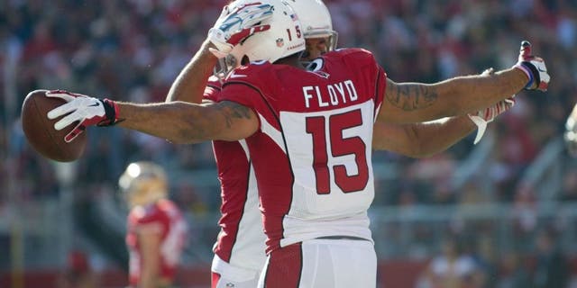 Dec 28, 2014; Santa Clara, CA, USA; Arizona Cardinals wide receiver Michael Floyd (15) celebrates with wide receiver Larry Fitzgerald (11) after scoring a touchdown during the first quarter against the San Francisco 49ers at Levi's Stadium. The against the San Francisco 49ers defeated the Arizona Cardinals 20-17. Mandatory Credit: Ed Szczepanski-USA TODAY Sports