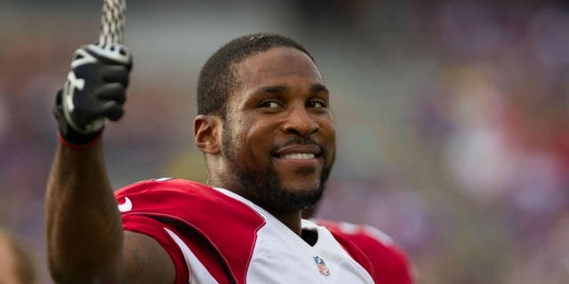 Aug 16, 2014; Minneapolis, MN, USA; Arizona Cardinals cornerback Patrick Peterson (21) smiles to the crowd prior to the game against the Minnesota Vikings at TCF Bank Stadium. Mandatory Credit: Brad Rempel-USA TODAY Sports
