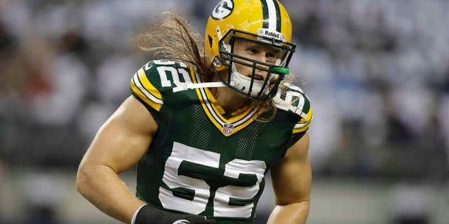 Dec 15, 2013; Arlington, TX, USA; Green Bay Packers outside linebacker Clay Matthews (52) on the field before the game against the Dallas Cowboys at AT&T Stadium. Mandatory Credit: Tim Heitman-USA TODAY Sports