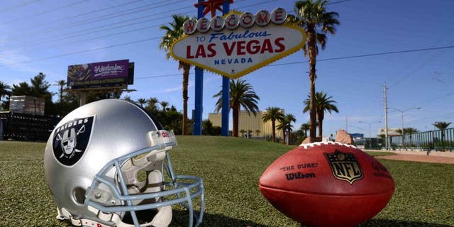 May 11, 2016; Las Vegas, NV, USA; General view of Oakland Raiders helmet and NFL Wilson Duke football at the "Welcome to Fabulous Las Vegas" sign on the Las Vegas strip on Las Vegas Blvd. Raiders owner Mark Davis (not pictured) has pledged $500 million toward building a 65,000-seat domed stadium in Las Vegas at a total cost of $1.4 billion. NFL commissioner Roger Goodell (not pictured) said Davis can explore his options in Las Vegas but would require 24 of 32 owners to approve the move. Mandatory Credit: Kirby Lee-USA TODAY Sports