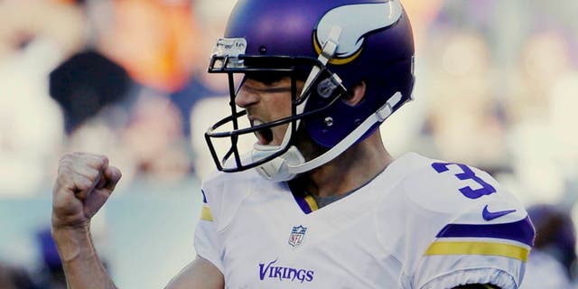 Minnesota Vikings kicker Blair Walsh pumps his fist after kicking the game-winning field goal against the Chicago Bears during the second half of an NFL football game Sunday, Nov. 1, 2015, in Chicago. The Vikings won 23-20.