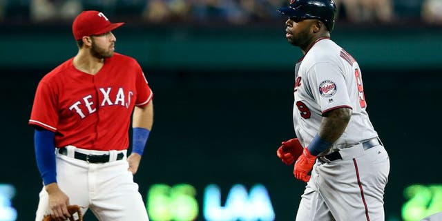 Apr 25, 2017; Arlington, TX, USA; Minnesota Twins designated hitter Kennys Vargas (19) rounds the bases in front of Texas Rangers third baseman Joey Gallo (13) after hitting a home run during the fourth inning at Globe Life Park in Arlington. Mandatory Credit: Kevin Jairaj-USA TODAY Sports