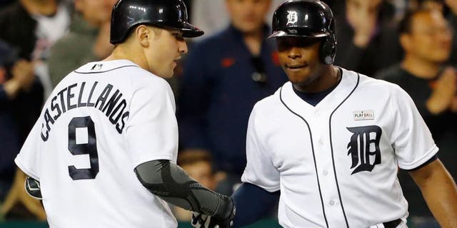May 16, 2016; Detroit, MI, USA; Detroit Tigers third baseman Nick Castellanos (9) receives congratulations from left fielder Justin Upton (8) after he hits a home run in the seventh inning against the Minnesota Twins at Comerica Park. Mandatory Credit: Rick Osentoski-USA TODAY Sports
