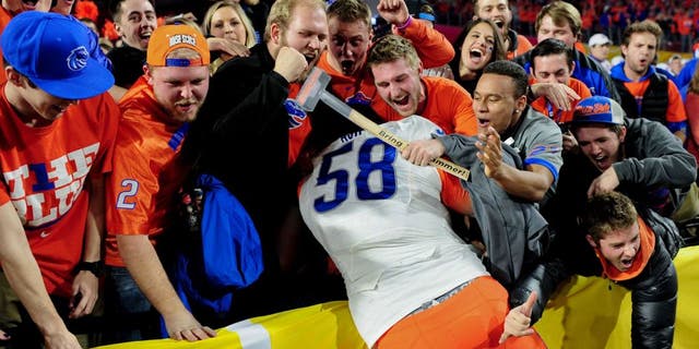 Dec 31, 2014; Glendale, AZ, USA;Boise State Broncos defensive tackle Robert Ash (58) celebrates after beating the Arizona Wildcats 38-30 in the 2014 Fiesta Bowl at Phoenix Stadium. Mandatory Credit: Matt Kartozian-USA TODAY Sports