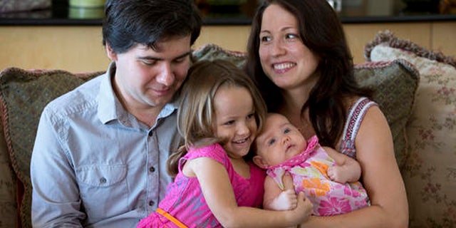 In this 2014 file photo, award-winning concert pianist Vadym Kholodenko, poses with his wife Sofya Tsygankova and daughters Nika, 4, and Michela, at their home in Fort Worth, Texas.