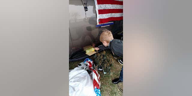 Malachi also placed a lemonade at the memorial for fallen deputy Jacob Pickett.