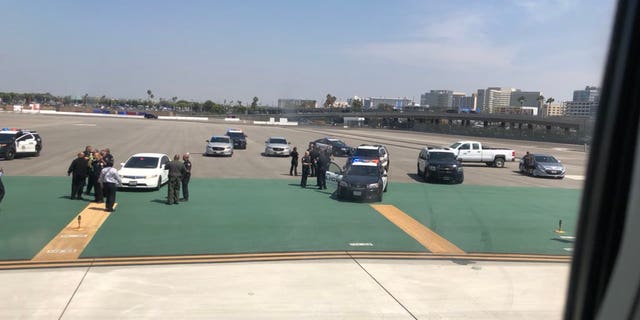 The unidentified man was spotted by Los Angeles International Airport police just after 1:30 p.m. local time.